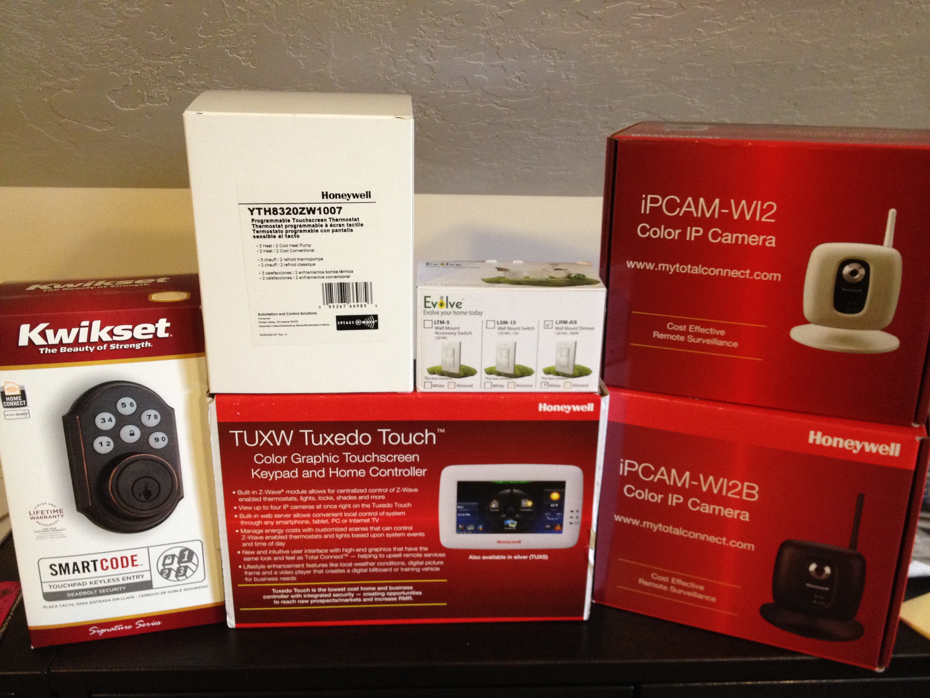 Honeywell Tuxedo Touch Keypad with Zwave Kwikset deadbolt, evolve light switch, honeywell thermostat, and honeywell ip cameras