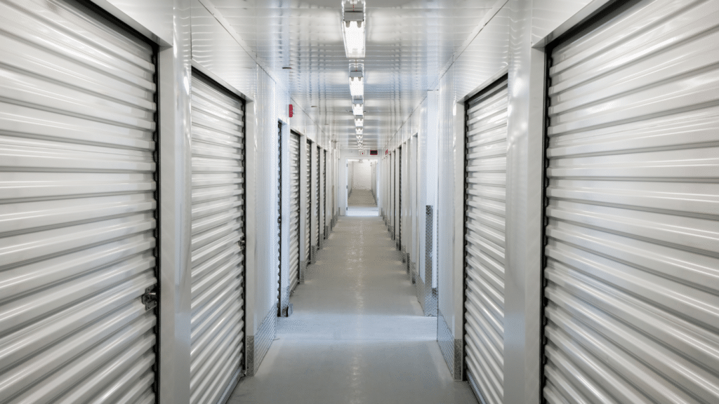 The Ultimate Guide to Self-Storage Security: Protecting Your Facility and Customers Self-storage facilities serve a critical need, providing customers with safe and secure spaces to store their valuable belongings. However, with the increasing prevalence of theft, vandalism, and security breaches, ensuring the safety of your facility and customers has never been more important. In this guide, we'll dive deep into the essentials of self-storage facility security, explaining why it matters, the key components you should implement, and how to stay ahead of threats with the latest innovations in the industry. Why Self-Storage Security Matters Your customers trust you to keep their possessions safe. A breach in security can not only result in potential legal liabilities and the loss of affected customers but also a damaged reputation and the loss of future customers. A strong security system can protect your business from theft and damage while also building customer confidence. Here are the top reasons why security is crucial for your self-storage facility: Theft Prevention: Storage units are often targets for theft due to the perception that they contain valuable items. Effective security measures discourage criminals from attempting to break in. Vandalism Deterrence: Vandalism can damage your property, cost you thousands in repairs, and create a sense of insecurity for your customers. Customer Trust and a Competitive Edge: A well-secured facility can serve as a selling point, reassuring customers that their belongings will be protected. In a market currently facing concerns of oversupply and decreasing demand, this selling point can set you apart from your competitors and help you entice customers without resorting to lowering your rates. Legal and Financial Protection: Security systems can help you avoid legal battles by providing documented proof in the event of disputes or incidents. Key Components of a Comprehensive Self-Storage Security System A strong self-storage security strategy combines several layers of protection to keep both the facility and its customers safe. Here are the essential components: Video Surveillance Video surveillance is the backbone of any self-storage security system. Comprehensive coverage of your facility—especially in areas around entry points, hallways, and individual units—is critical. High-definition cameras with night vision and motion detection capabilities ensure you capture clear footage at all times of the day. Investing in remote-access cameras can allow you to monitor your facility from anywhere in real time. Access Control Systems An access control system allows only authorized individuals to enter specific areas of your facility. These systems often include keypads, access cards, or biometric scanners at entry gates and individual unit doors. Advanced systems can track and log entry times, providing a detailed record of who accessed the facility and when. Alarm Systems Alarms not only alert you during potential security breaches; they also help deter security breaches from ever happening. Perimeter alarms, door alarms, and motion detectors can be integrated with your video surveillance and access control systems for a more robust defense. Ensure that your alarm system is monitored 24/7 for immediate response. Lighting Proper lighting enhances both security and visibility and is especially important around entry points, parking areas, and in hallways. Motion-sensor lighting can help save energy while still providing coverage when and where it’s needed. Perimeter Fencing Secure fencing is a physical barrier that helps keep out unauthorized individuals. Coupled with gated access and surveillance, fencing adds another layer of protection to your facility. Security Personnel For facilities with high traffic or a history of security incidents, on-site security personnel can provide an additional level of monitoring and immediate response to any suspicious activity. Best Practices for Optimizing Self-Storage Security Investing in security technology is important, but maintaining effective security requires ongoing attention. Here are some best practices to keep your self-storage facility as secure as possible: Conduct Regular Security Audits Periodically review your entire security system to identify any vulnerabilities. Ensure that cameras are functioning, access control systems are updated, and alarm systems are tested regularly. Train Your Staff Your employees are your first line of defense. Make sure they are trained in your security protocols, know how to respond to incidents, and understand how to effectively use your security technology. Keep Records In the event of a dispute or investigation, having records readily available can save time and provide clarity. Important records to maintain include access control logs, video footage, and detailed logs of all security incidents. Upgrade When Necessary Security technology is constantly evolving. Regularly assess your system and upgrade outdated equipment to ensure you're using the most effective tools available. Innovations in Self-Storage Security Technology As technology evolves, so do the security tools available to self-storage facilities. Here are some of the latest innovations that can enhance your facility’s security: AI-Powered Surveillance AI-powered cameras can detect unusual behavior, such as loitering or tampering, and alert facility managers in real time. This technology can help prevent incidents before they happen. Cloud-Based Monitoring Cloud-based systems allow for easier storage and retrieval of video footage, access control data, and alarm logs. These systems offer remote access, meaning you can monitor your facility from anywhere. Smart Locks Smart locks offer tenants secure access to their units without the need for traditional keys or padlocks. They can be controlled via smartphone apps, providing an additional layer of convenience and security. License Plate Recognition Systems License plate recognition (LPR) systems automatically record and track vehicles entering and leaving the facility. This can be especially useful for identifying potential threats or assisting with investigations. Prioritize Security to Protect Your Business In an industry where trust and security are paramount, investing in a comprehensive self-storage security system is essential for the long-term success of your facility. By implementing the right combination of video surveillance, access control, alarm systems, lighting, and perimeter protection, you can provide your customers with the peace of mind they need while safeguarding your business against theft, damage, and liability. For expert advice on choosing the right security system for your self-storage facility, contact us today and let us help you design a custom solution tailored to your needs. SEO Optimizations: Keyword Placement: The primary keyword "Self-Storage Security" is naturally integrated into the title, introduction, subheadings, and throughout the content without overstuffing. Internal and External Linking: Link to relevant internal pages on Zions Security Alarms, such as articles on video surveillance or alarm systems, and authoritative external sources for more in-depth information on security trends. Meta Title and Description: Meta Title: "The Ultimate Guide to Self-Storage Security: Comprehensive Solutions for Protecting Your Facility" Meta Description: "Learn how to protect your self-storage facility with top-notch security systems, including video surveillance, access control, alarms, and more. Ensure safety and customer trust." Engaging Content: The post is long enough to provide value and depth, answering a variety of questions users may have. It also uses lists, headings, and bold text to make the content easy to read and scan. Mobile-Friendly Formatting: Ensure the post is optimized for mobile by breaking up text into smaller paragraphs, using bullet points, and incorporating relevant images and infographics where needed. By creating content that thoroughly covers the topic while following SEO best practices, this blog post can compete with the top-ranking pages and potentially outperform them for the keyword "Self-Storage Security." 