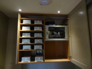 12 sonos connect amps in cupboard