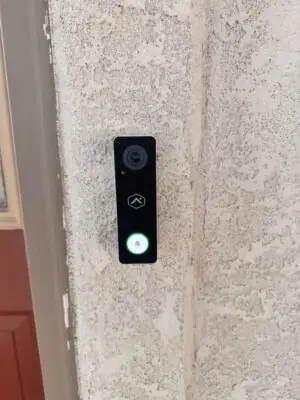 Alarm.com video doorbell installed on a home